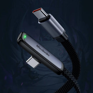 Two USB connectors with braided cable on a dark background, featuring the Mcdodo brand.