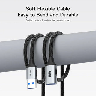 Two HAGIBIS brand USB cables on a gray surface with text about soft flexibility and durability.
