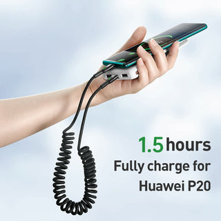 Person holding a smartphone with a charging cable and power bank, with text indicating charging time for Huawei P20.