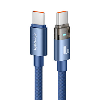 A blue Mcdodo 100W USB-C to USB-C charging cable on a solid white background, showing both connector ends with metallic silver details and blue protective rings.