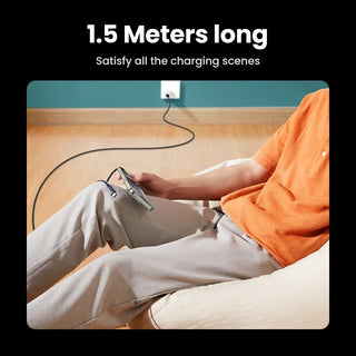 Person sitting on a couch holding a 1.5 meter long charging cable.
