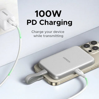 Ugreen enclosure charging a smartphone with text '100W PD Charging' on a white background
