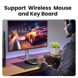 Person playing a racing game on a computer with a wireless mouse and keyboard support text above.